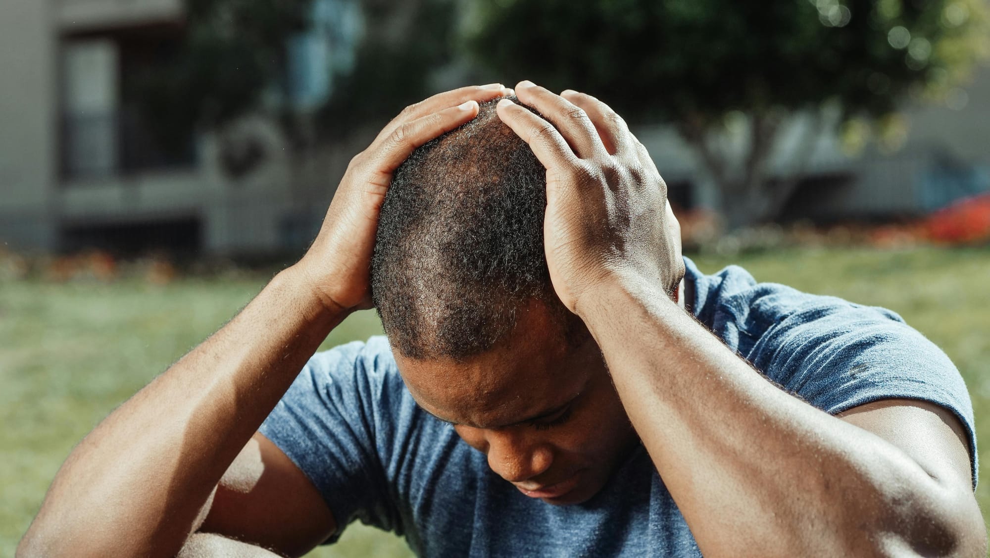 Man suffering from a headache from heading a soccer ball